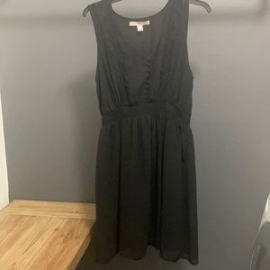 Black sleeveless dress with slip underneath